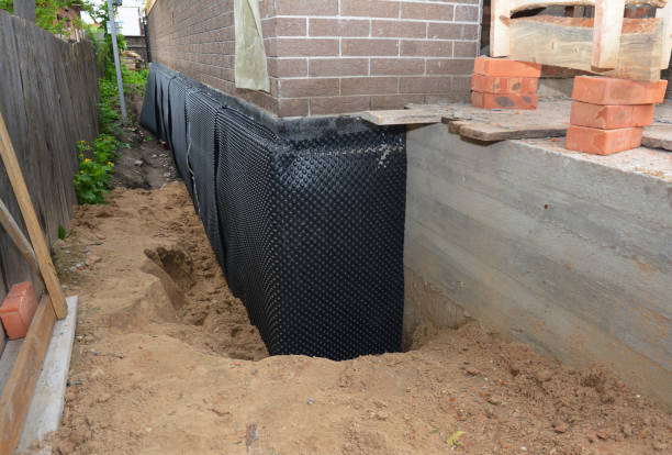 Happy homeowners after waterproofing job in Flag Pond